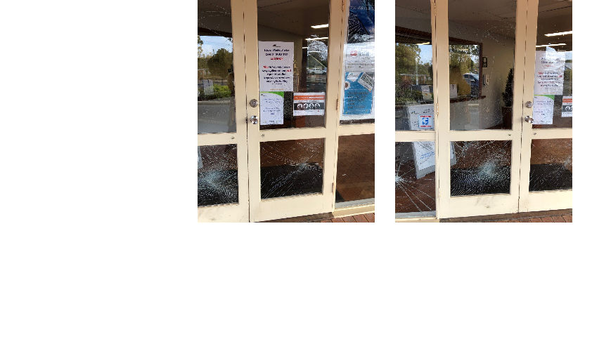 Shattered glass in doors of church